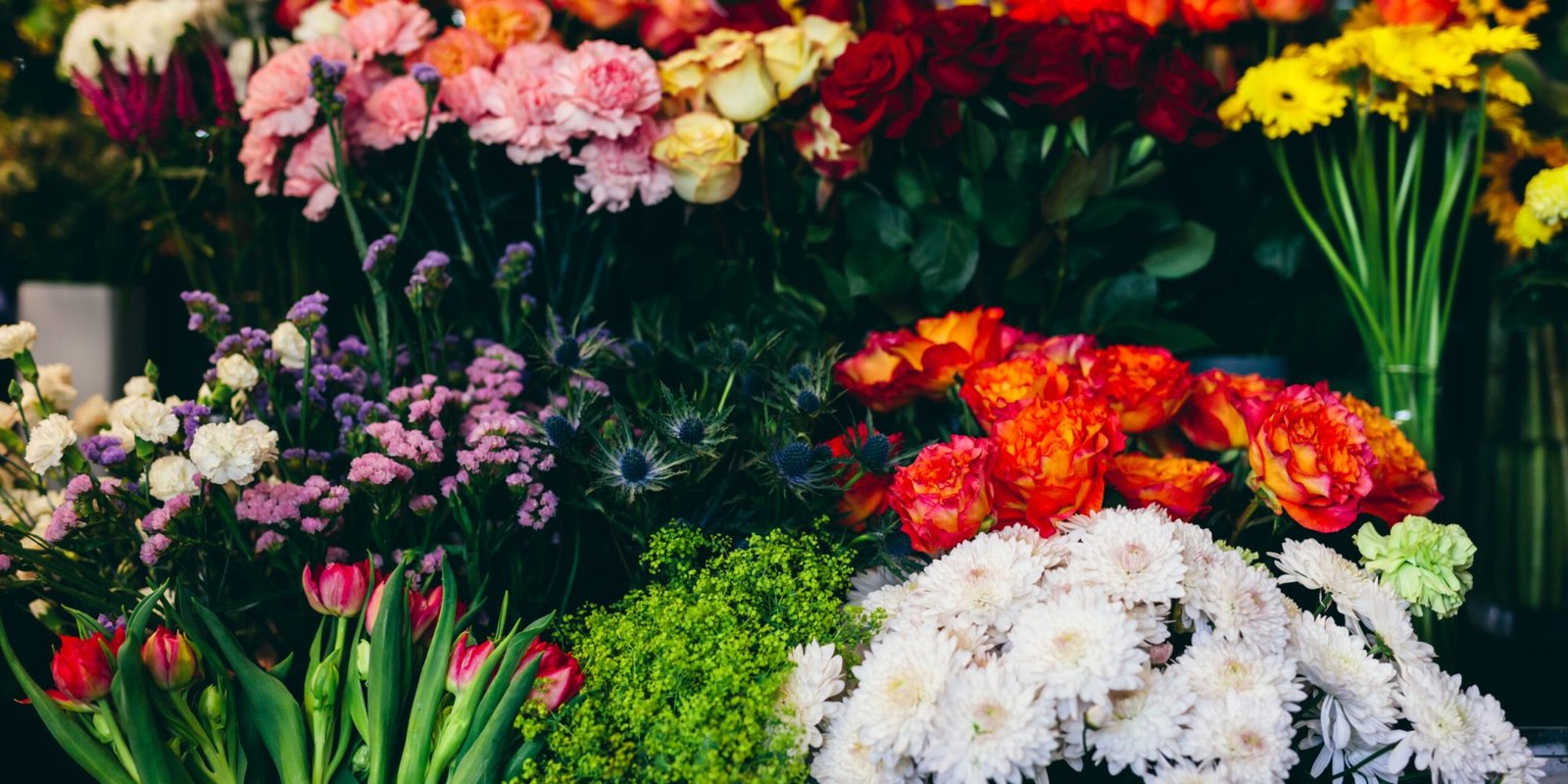 Colorful flowers on flower market. Shopping, retail, small business. Natural decorations.